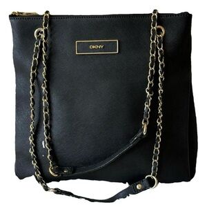 DKNY black leather shoulder bag with extra straps.
